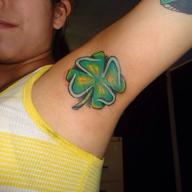 Yellow And Green Shamrock Tattoo On Armpit