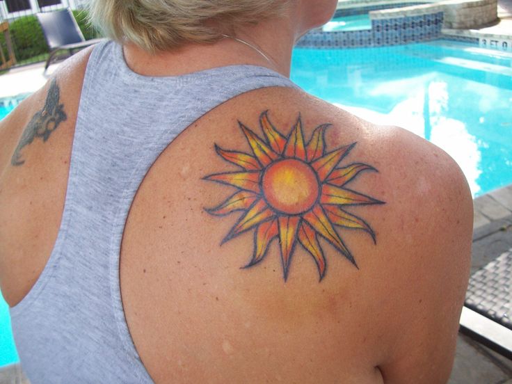 Yellow And Orange Sun Tattoo On Girl Right Back Shoulder