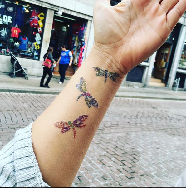 Amazing Flying Dragonflies Tattoos On Forearm