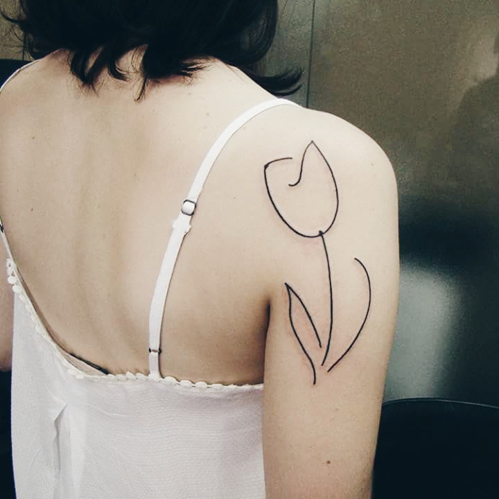 Amazing Outline White Tulip Tattoo On Girl Right Back Shoulder