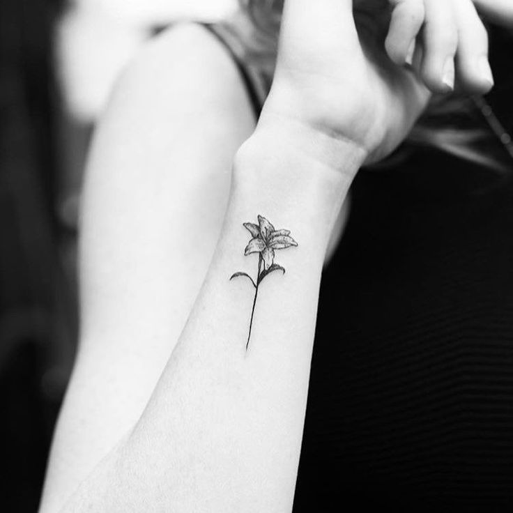 Amazing Small Lily Tattoo On Right Wrist