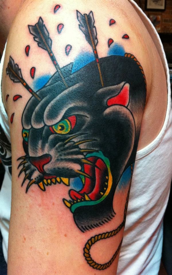 Arrows Pierced In Traditional Panther Head Tattoo On Shoulder