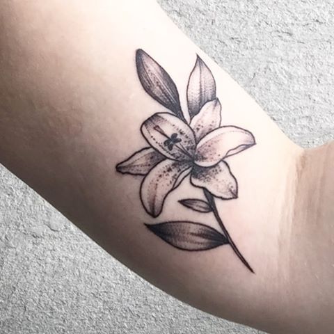 Awesome Grey Small Lily Tattoo On Bicep
