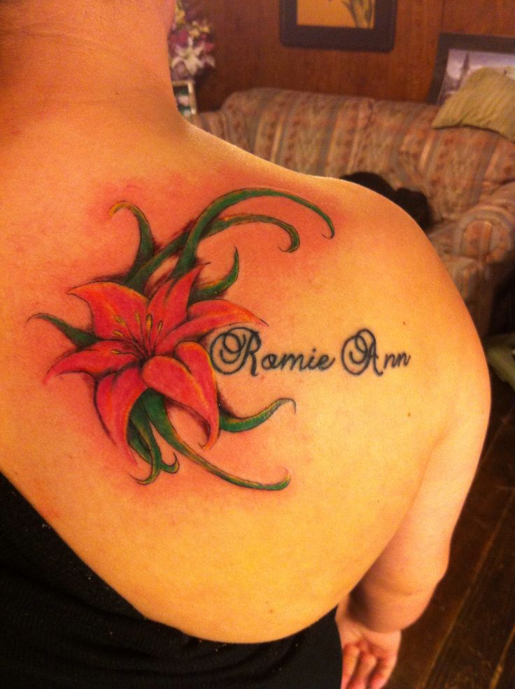Awesome Lily Flower Tattoo On Girl Back Shoulder