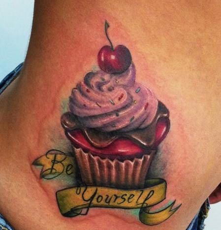 Be Yourself Banner And Realistic Cupcake Tattoo On Side Neck