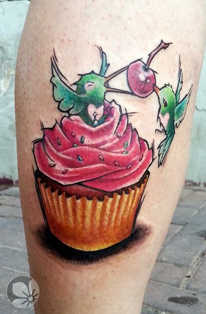 Birds Eating Cherry From Cupcake Tattoo On Leg