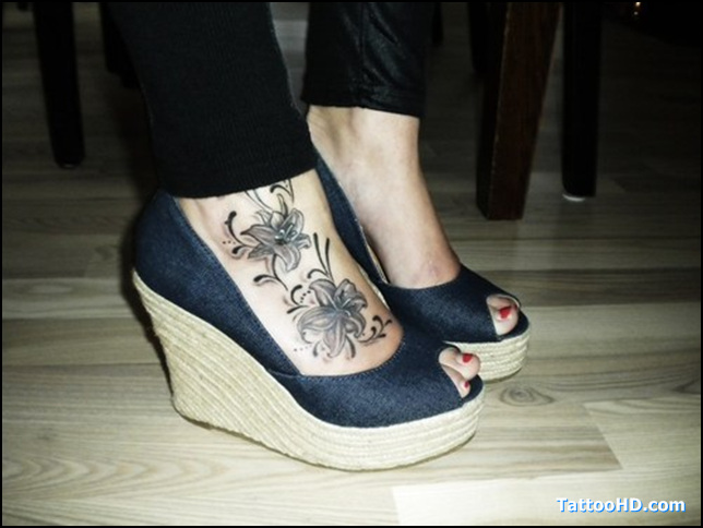 Black And Grey Lily Flower Tattoo On Right Foot