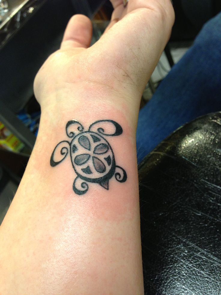 Black And Grey Peace Turtle Tattoo On Left Wrist