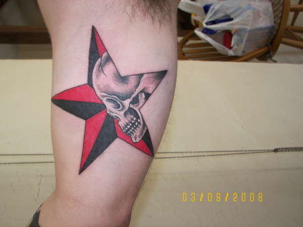 Black And Red Nautical Star With Skull Tattoo On Inner Bicep