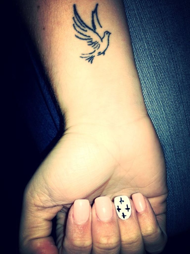 Black Flying Dove Tattoo On Right Wrist