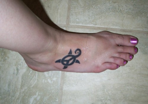 Black Ink Peace Symbol Turtle Tattoo On Girl Right Foot
