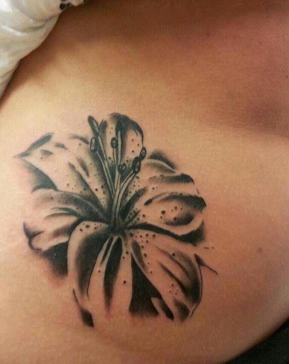 Black Lily Flower Tattoo On Hip