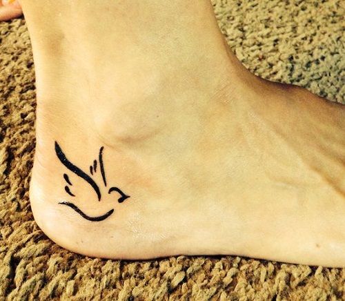 Black Outline Flying Small Dove Tattoo On Right Heel