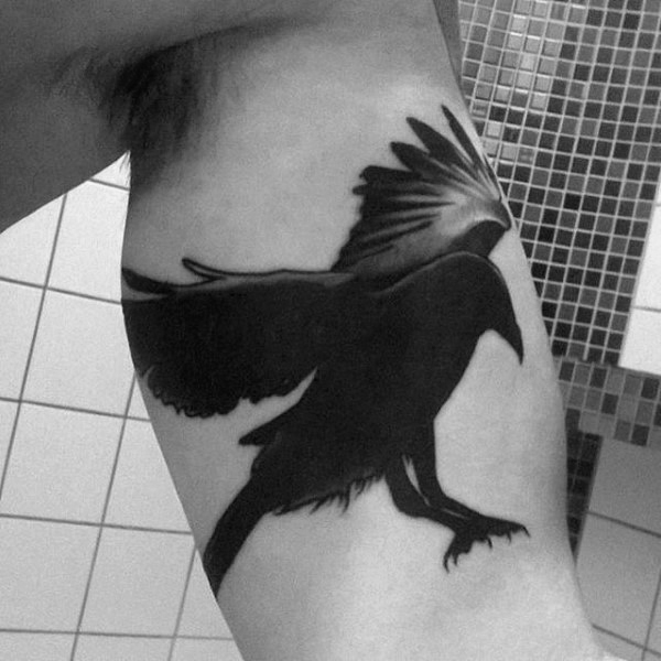 Black Silhouette Raven Tattoo On Inner Bicep