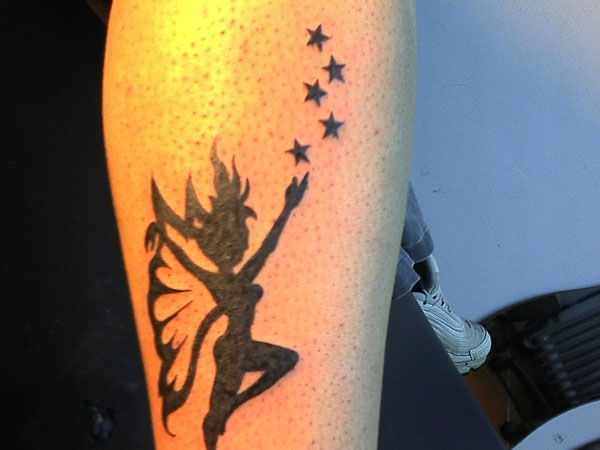 Black Stars And Fairy Tattoo On Leg