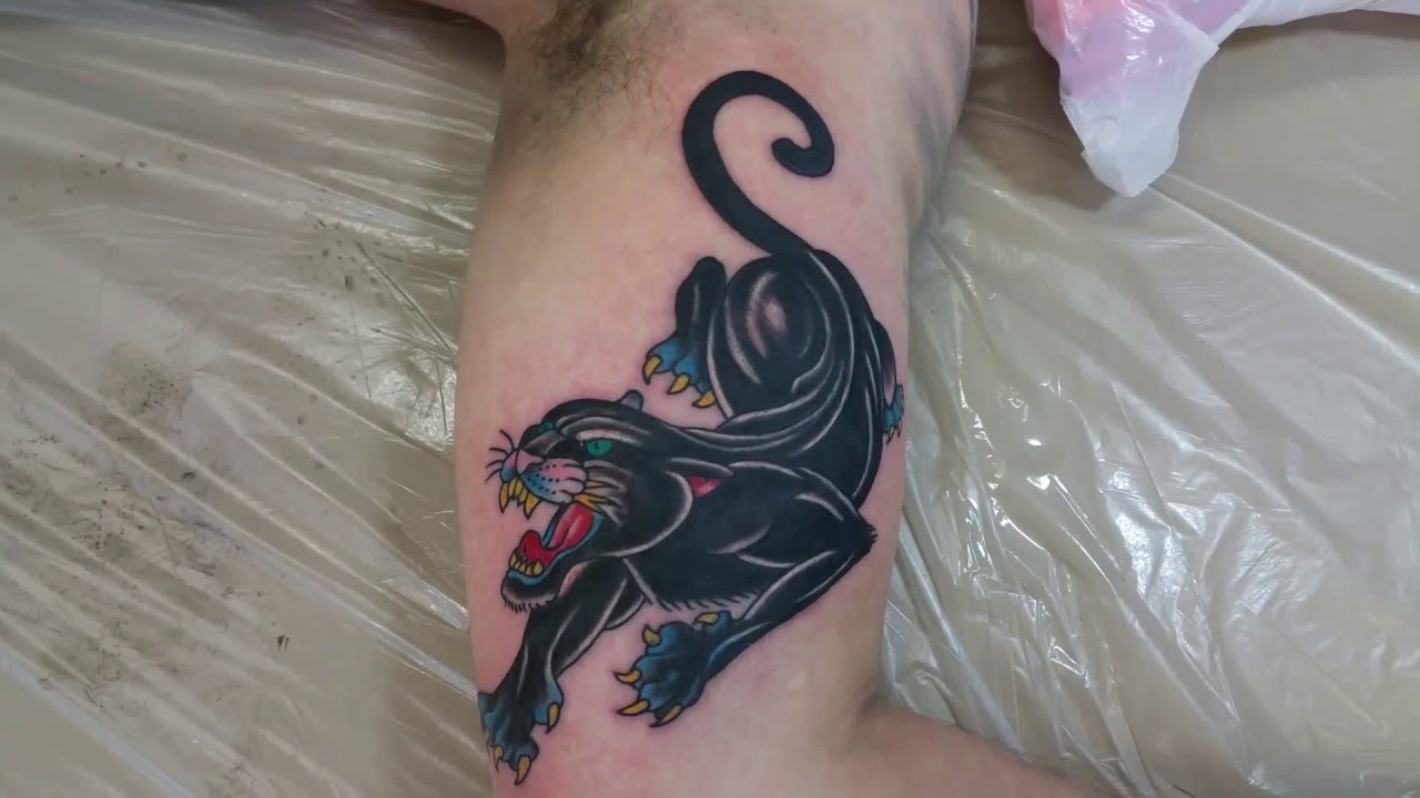 Black Traditional Panther Tattoo On Inner Bicep