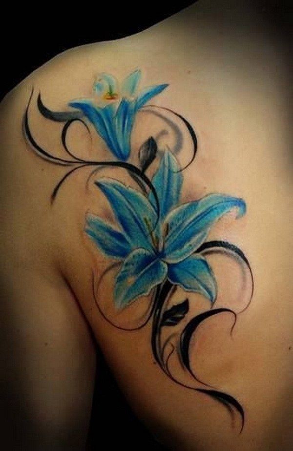 Black Tribal And Blue Lily Tattoo On Left Back Shoulder
