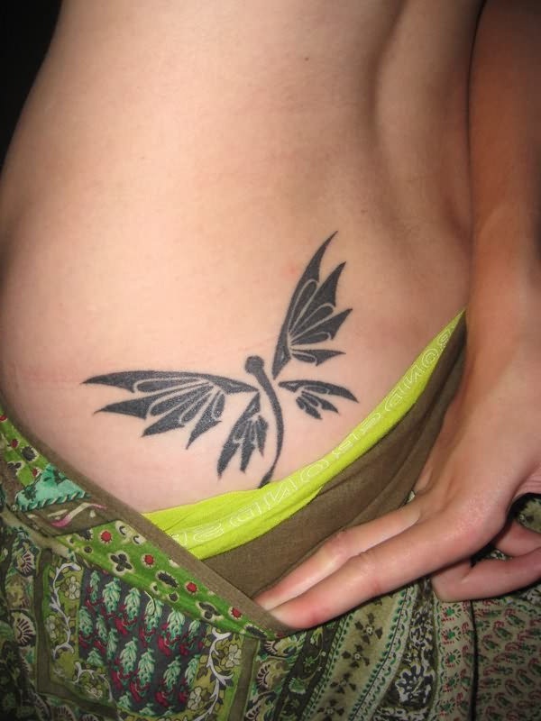 Black Tribal Dragonfly Tattoo On Girl Lower Back