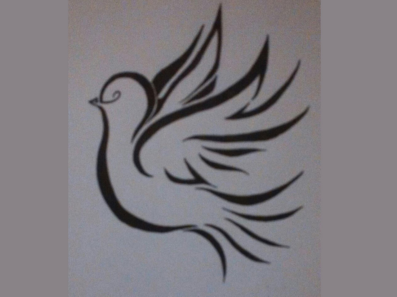 Black Tribal Flying Dove Tattoo Design