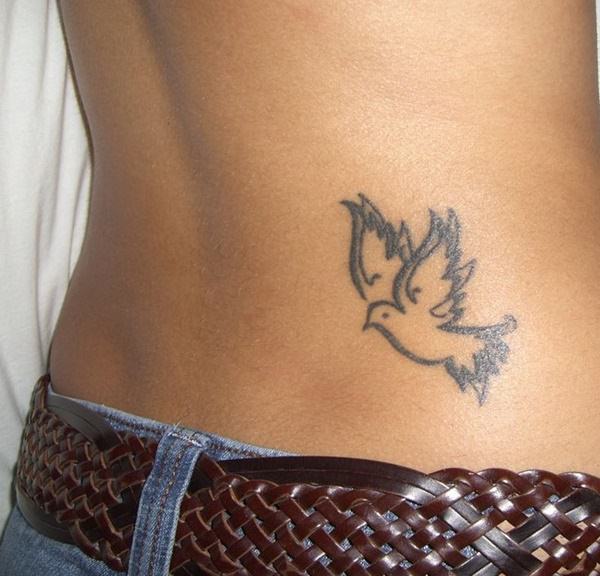 Black Tribal Outline Flying Dove Tattoo On Lower Back