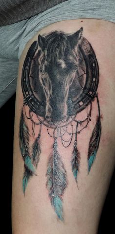Blue And Black Horse Head Tattoo On Left Thigh