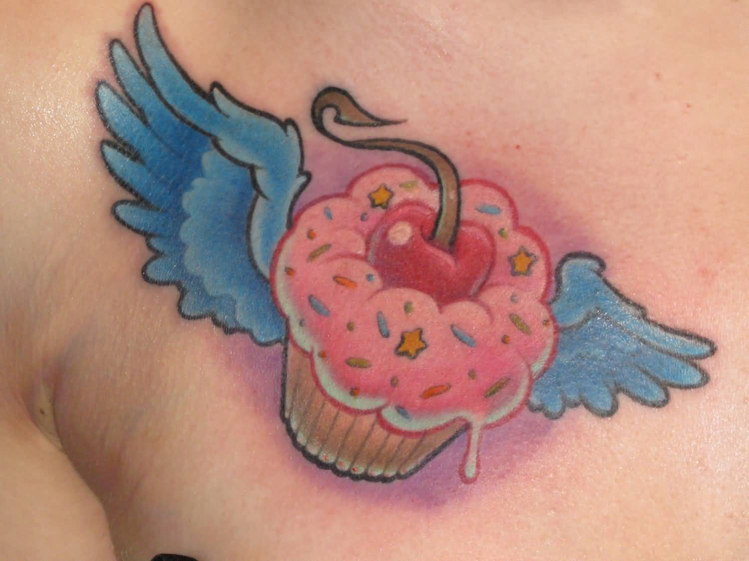 Blue Angel Wings With Cupcake Tattoo
