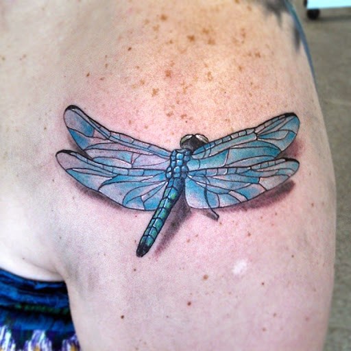 Blue Ink Dragonfly Tattoo On Left Shoulder