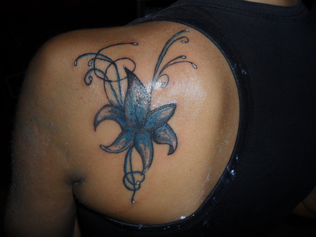 Blue Lily Flower Tattoo On Back Shoulder.