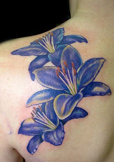 Blue Lily Flowers Tattoos On Left Back Shoulder