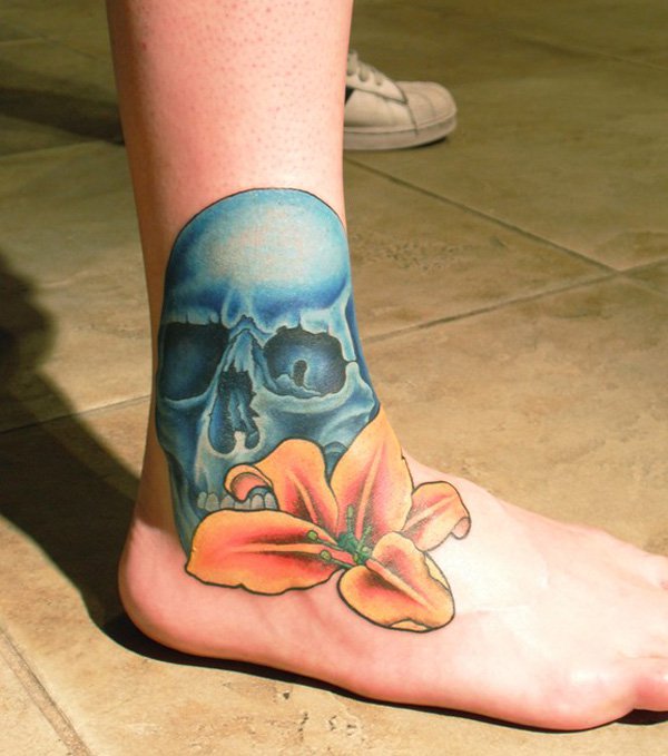 Blue Skull And Lily Tattoo On Right Foot