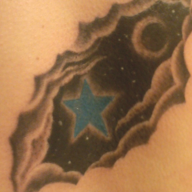 Blue Star In Clouds Tattoo Idea
