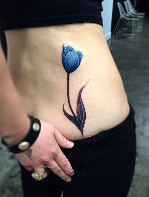 Blue Tulip Flower Tattoo On Lower Back