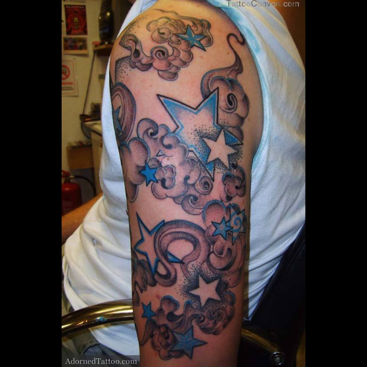 Blue and Grey Stars In Clouds Tattoo On Half Sleeve