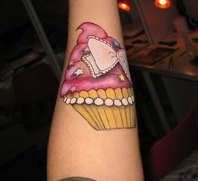 Bow Cupcake Tattoo On Forearm