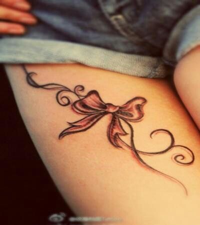 Bow Tattoo On Girl Right Thigh