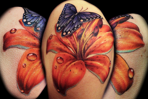Butterfly And Realistic Lily Tattoo On Shoulder