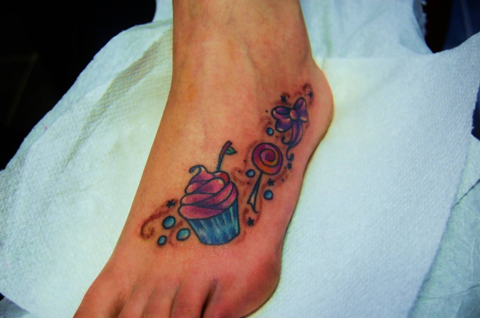 Candies And Realistic Cupcake Tattoo On left Foot