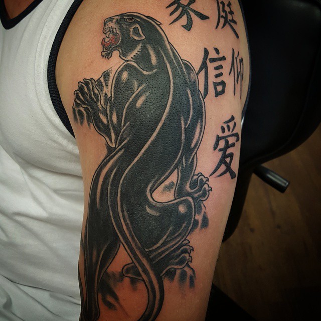 Chinese Symbols And Black Panther Tattoo On Half Sleeve