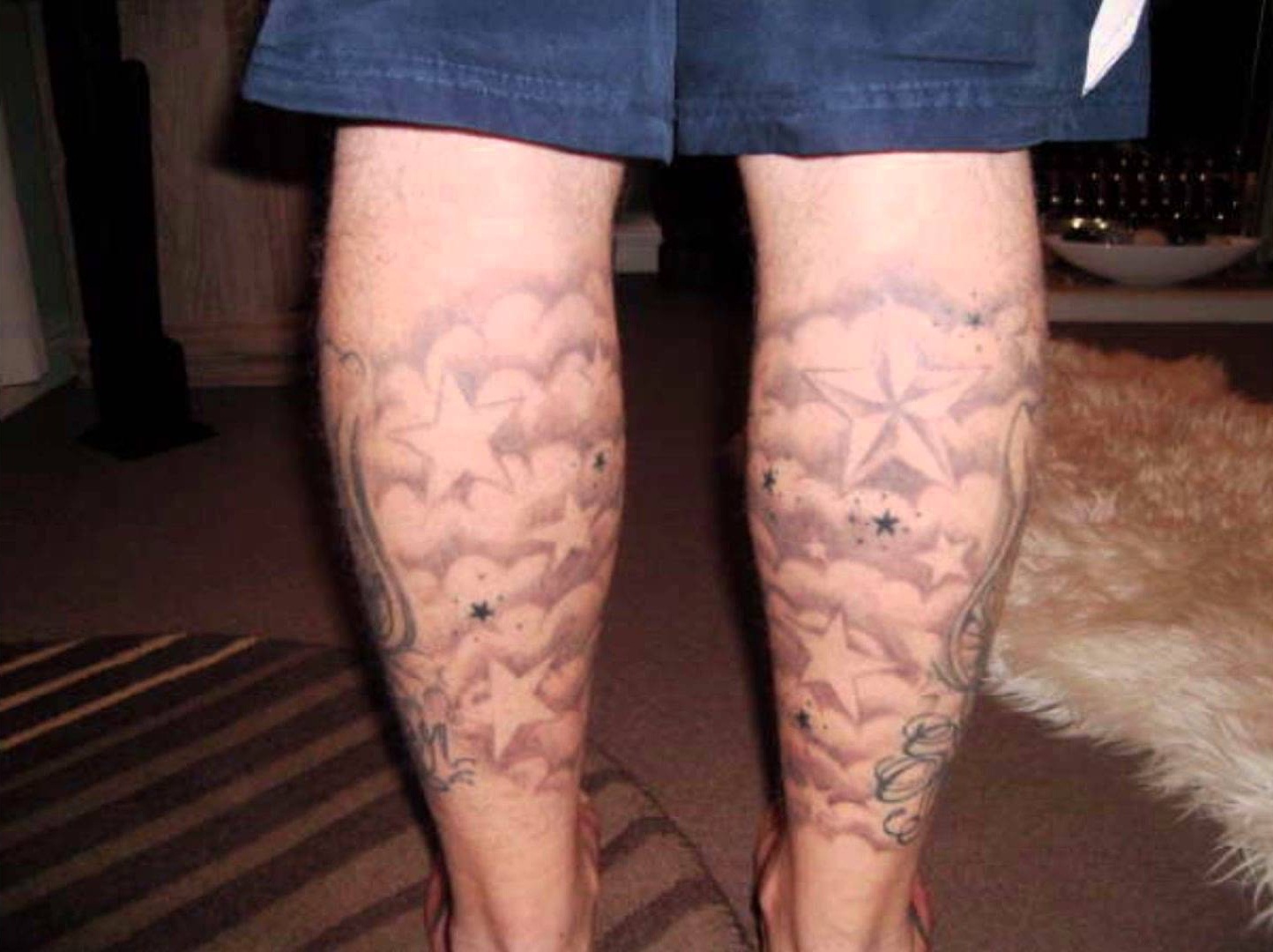 Clouds And Stars Tattoos On Back Legs
