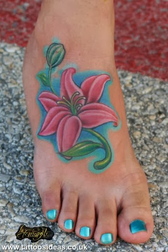 Colored Blue And Pink Lily Flowers Tattoo On Right Foot