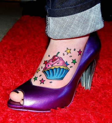 Colored Stars And Realistic Cupcake Tattoo On Foot
