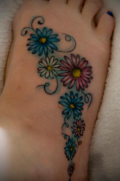 Colorful Daisy Flowers Tattoo On Girl Right Foot
