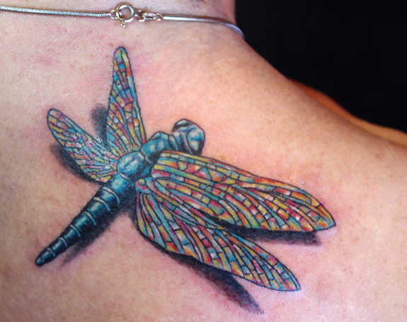 Colorful Dragonfly Tattoo On Upper Back