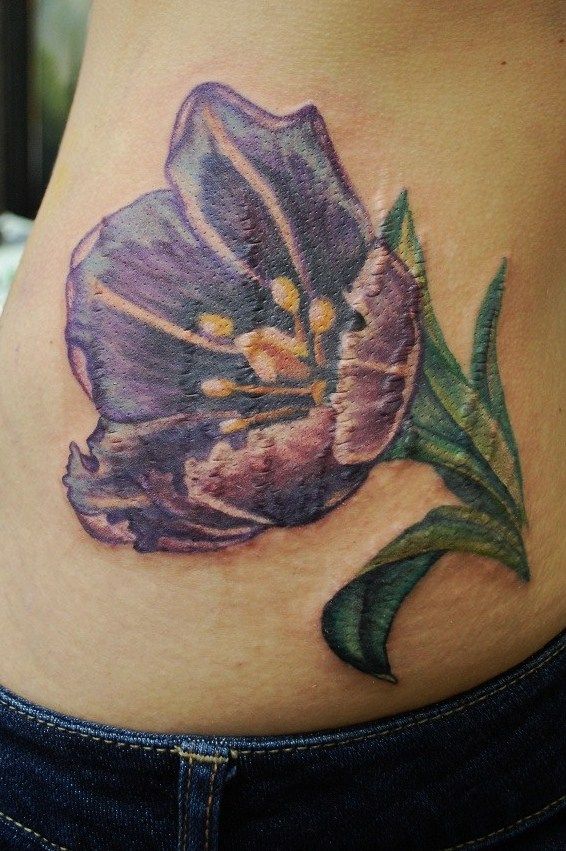 Cool Purple Tulip Flower Tattoo On Lower Back