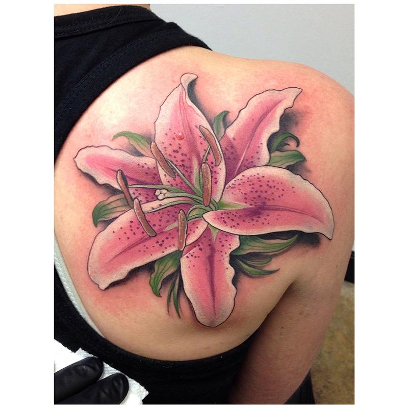 Cool Realistic Lily Tattoo On Girl Right Back Shoulder