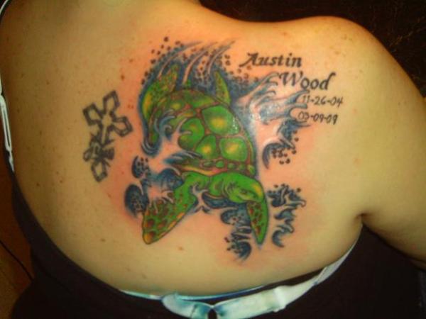 Cross And Memorial Turtle Tattoo On Right Back Shoulder