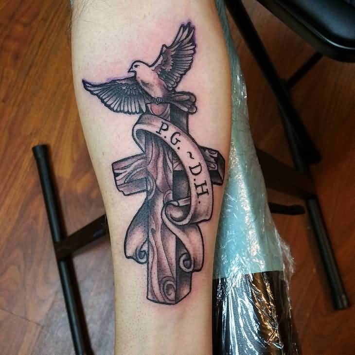 Cross With Banner And Flying Peace Dove Tattoo On Forearm