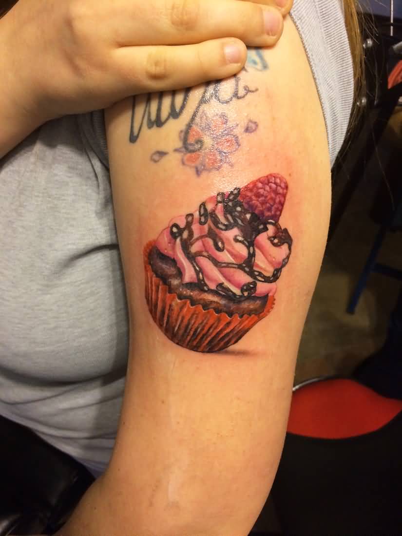 Cupcake Tattoo On Girl Left Bicep