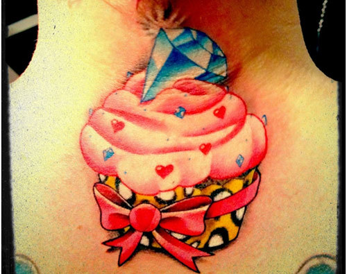 Cupcake With Blue Diamond Tattoo On Upper BAck