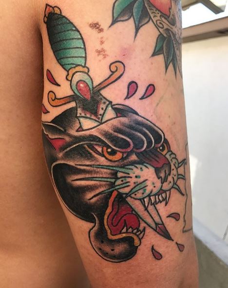 Dagger Pierced In Traditional Panther Head Tattoo